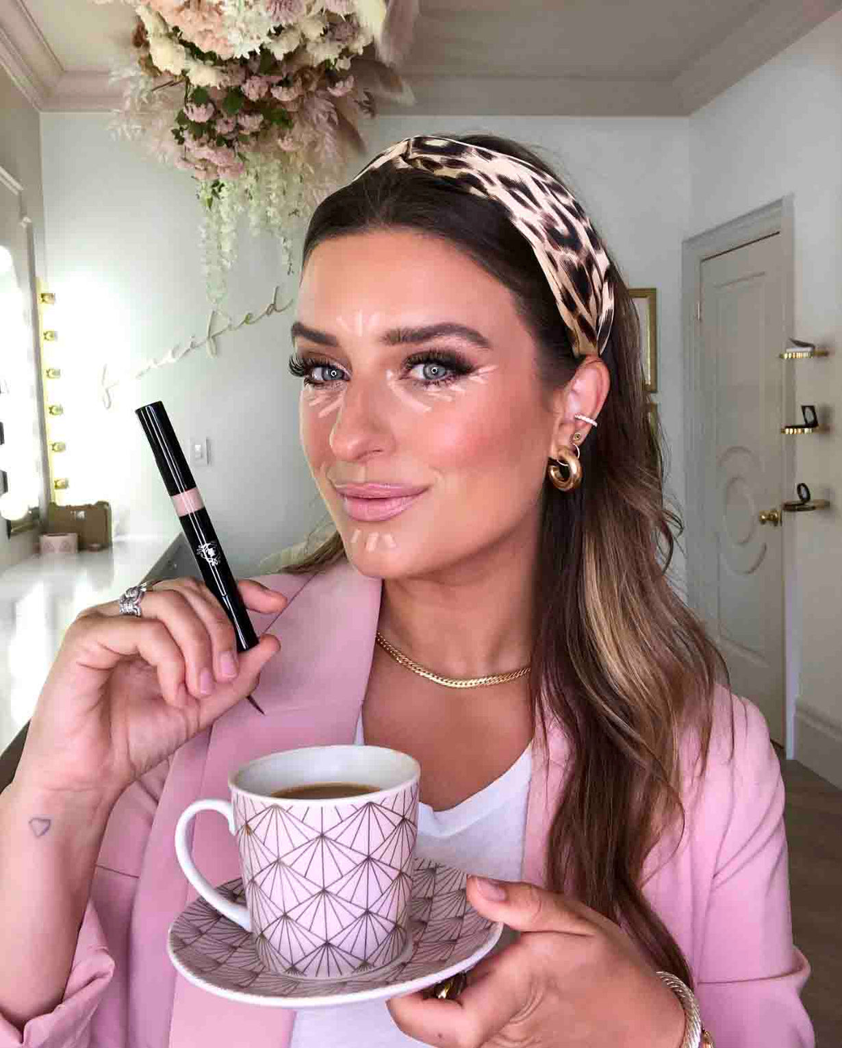 Bride using primer for dewy skin